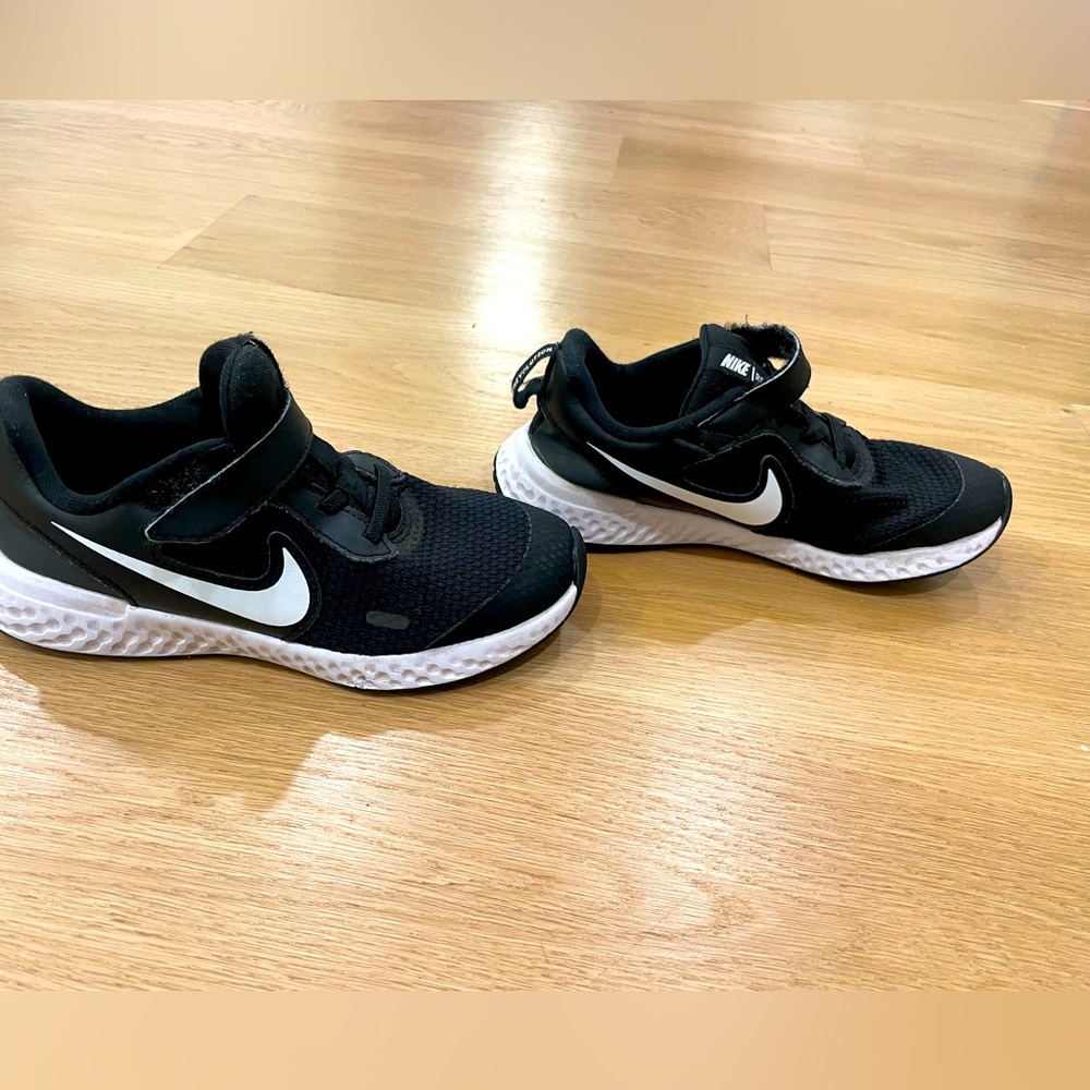 Boys black Nike sneakers